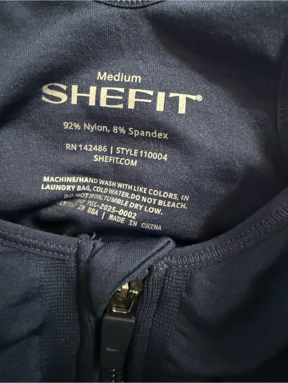 SHEFIT Front-Zip Sports Bra & High-Waist Bike Shorts in Navy - Picture 4 of 4
